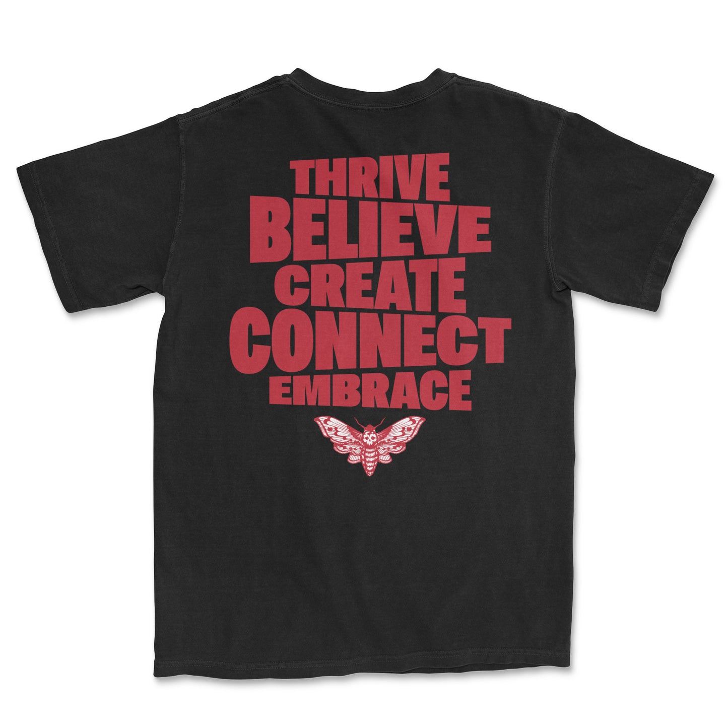 Back of a black t-shirt with large red text reading "THRIVE BELIEVE CREATE CONNECT EMBRACE" and a detailed red moth graphic below it.