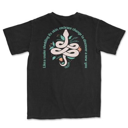 Black PSTVE Brand t-shirt with a back graphic of a snake and floral design, surrounded by the text: "Like a snake shedding its skin, embrace change to discover a new you". - PSTVE Brand