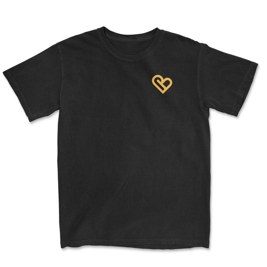 Black crew neck t-shirt with a minimalist yellow heart design on the left chest - PSTVE Brand