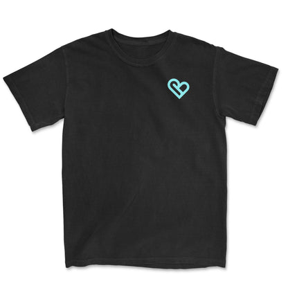 Image of a black t-shirt with a heart shaped logo on the right chest. - PSTVE Brand